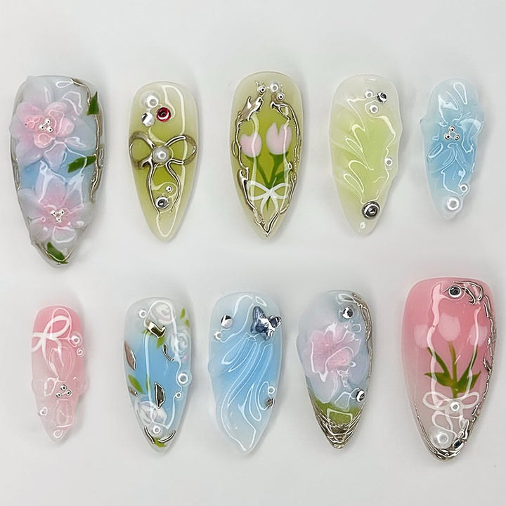 Creative nail set with hand-drawn floral patterns and glitter accents Kalsten