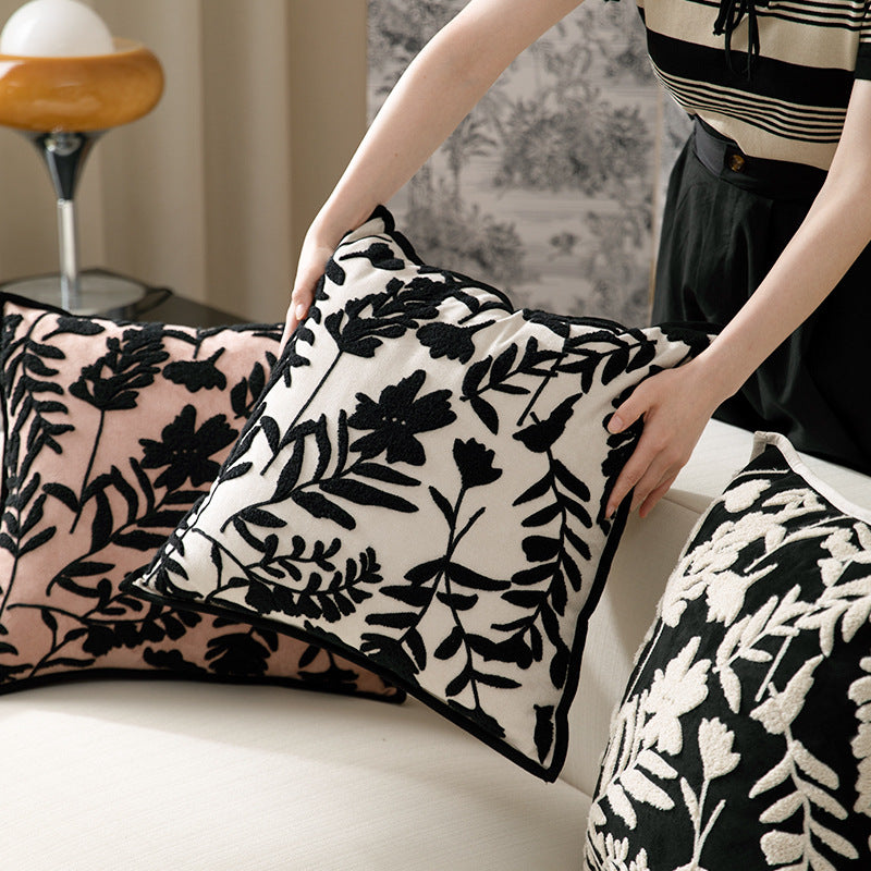Square decorative pillow with floral flock embroidery and fine piping edge