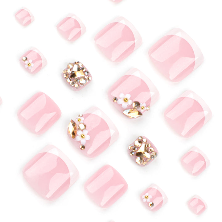 Artistic toenail art with elegant flower and glitter accents Kalsten