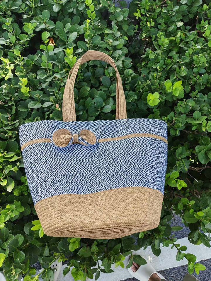 Elegant straw bag with decorative bow closure Kalsten