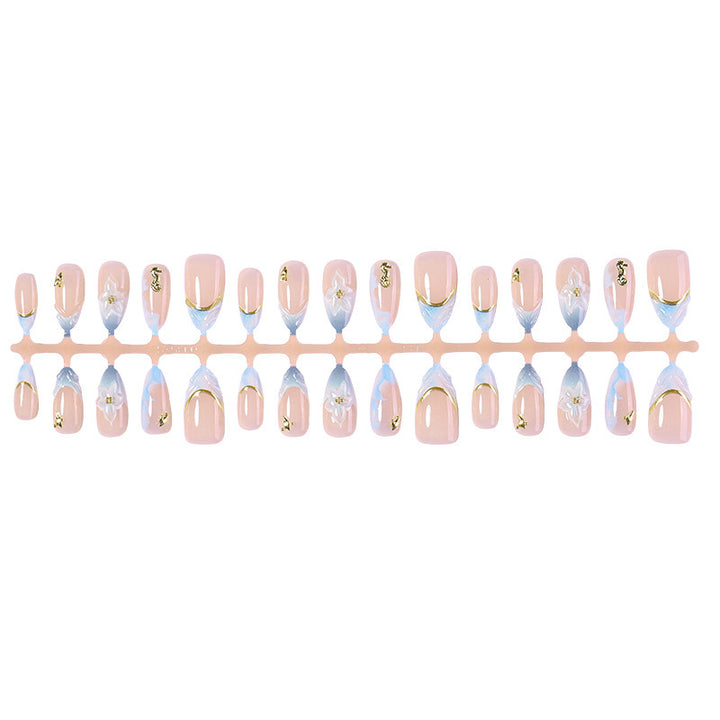 Creative nail set with elegant gold embellishments Kalsten