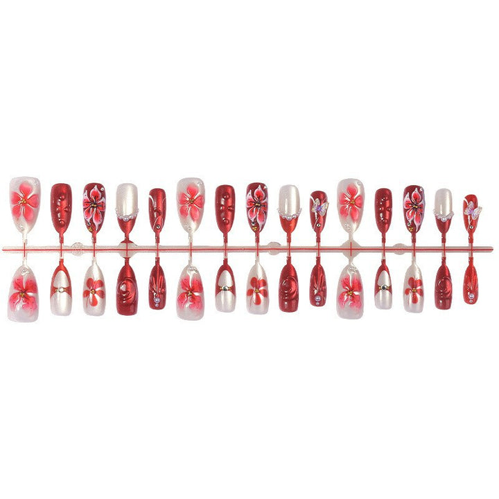 Artificial nail set with floral designs and glitter elements Kalsten