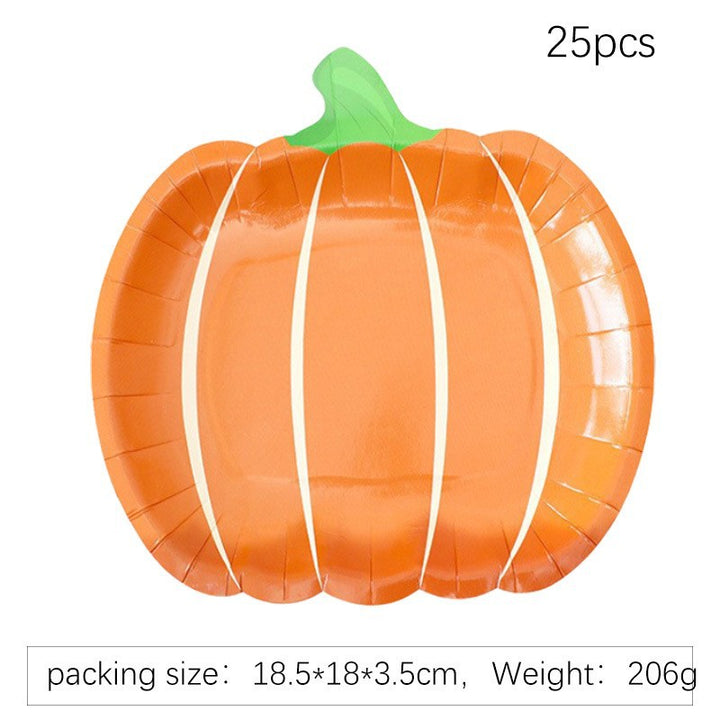 Disposable paper plates in pumpkin shape with spooky face design