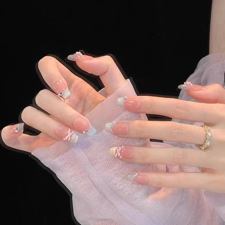 Elegant French Tip Nail Extensions with Floral Accents