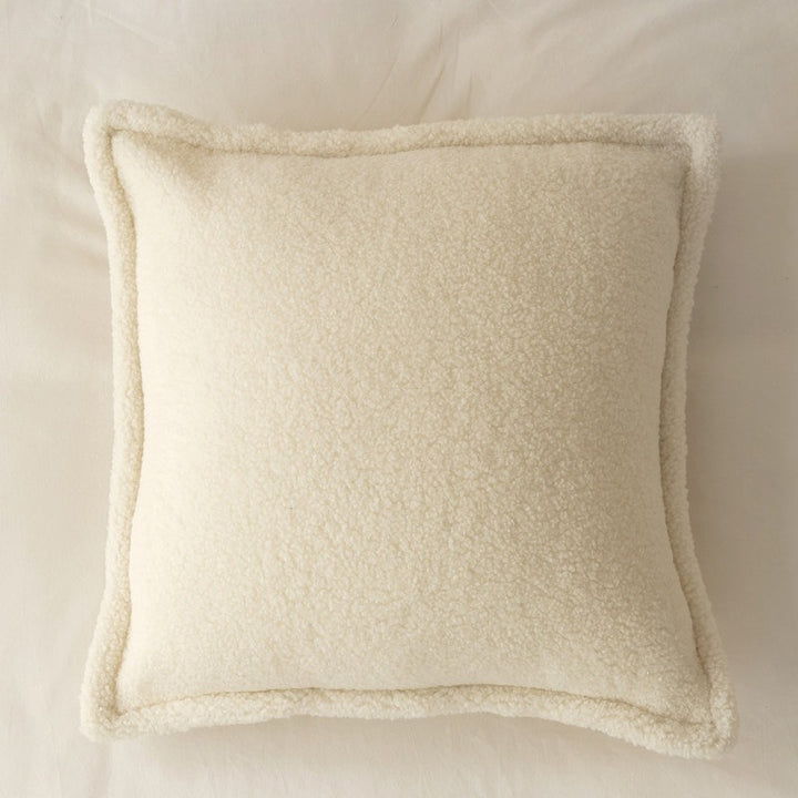 Decorative teddy fleece cushion with padded filling and piped seam