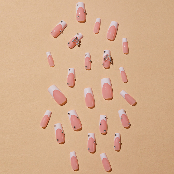 Artificial nails with elegant French tips and glitter accents Kalsten