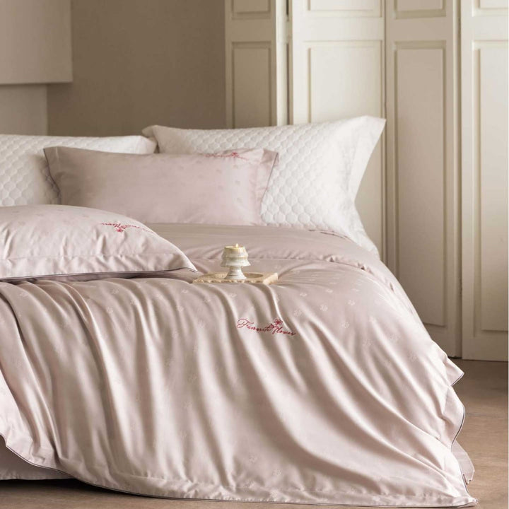 Luxurious satin bedding complete set with quilted cover and delicate logo embroidery