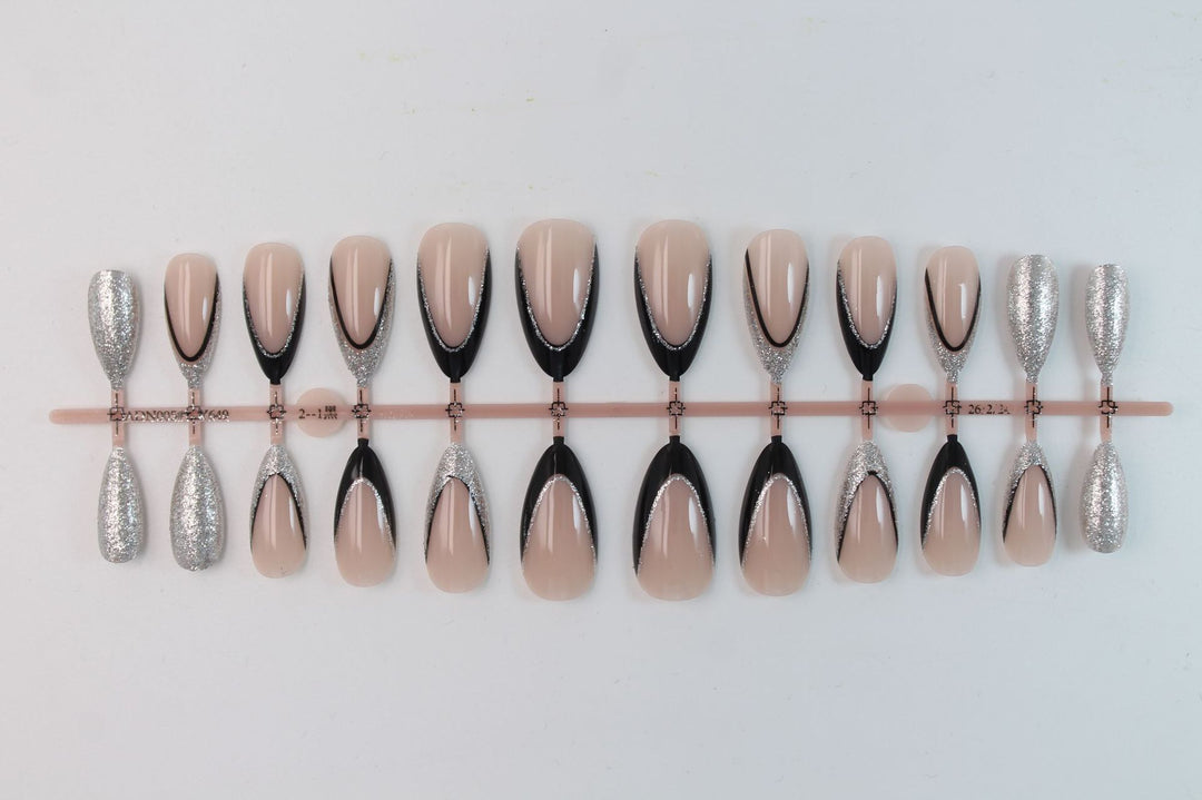 Artificial nail set with glamorous glitter accents and elegant black Kalsten