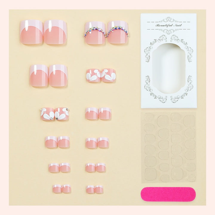 Creative nail art set with elegant flower designs and glitter accents Kalsten