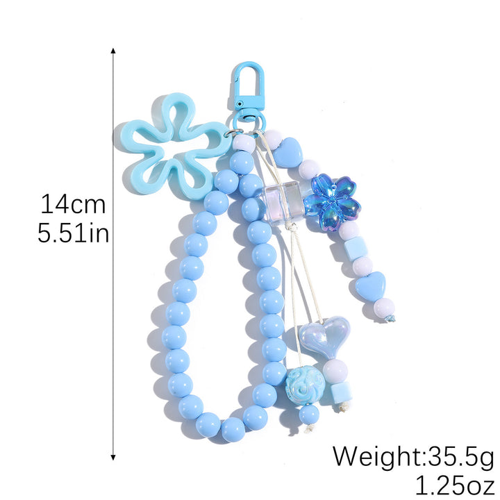 Playful keychain with flower and butterfly details Kalsten