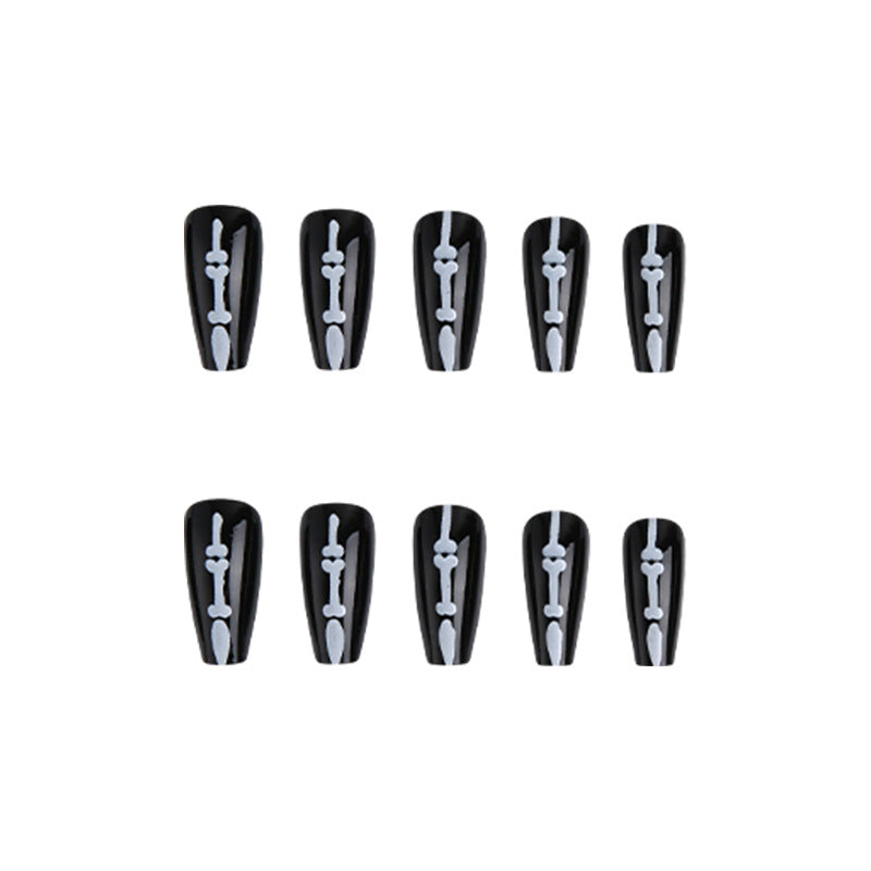 Artistic nail art with skull and bone motif Kalsten