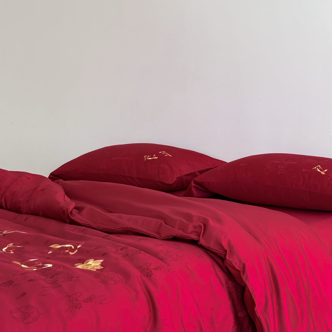 Luxurious bed linen set made of cotton satin with embroidered koi motifs and fine jacquard structure