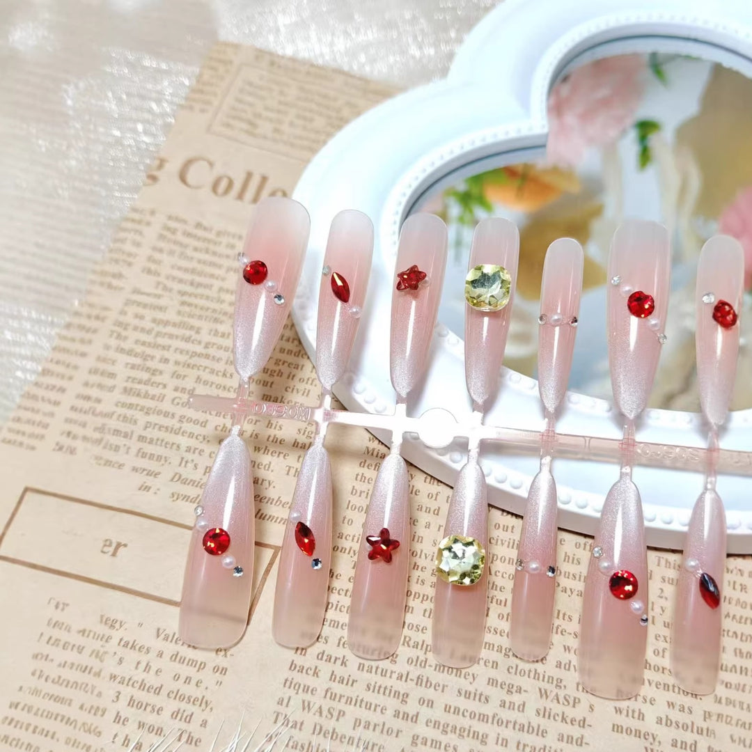 Glamorous artificial nails with shimmering embellishments Kalsten