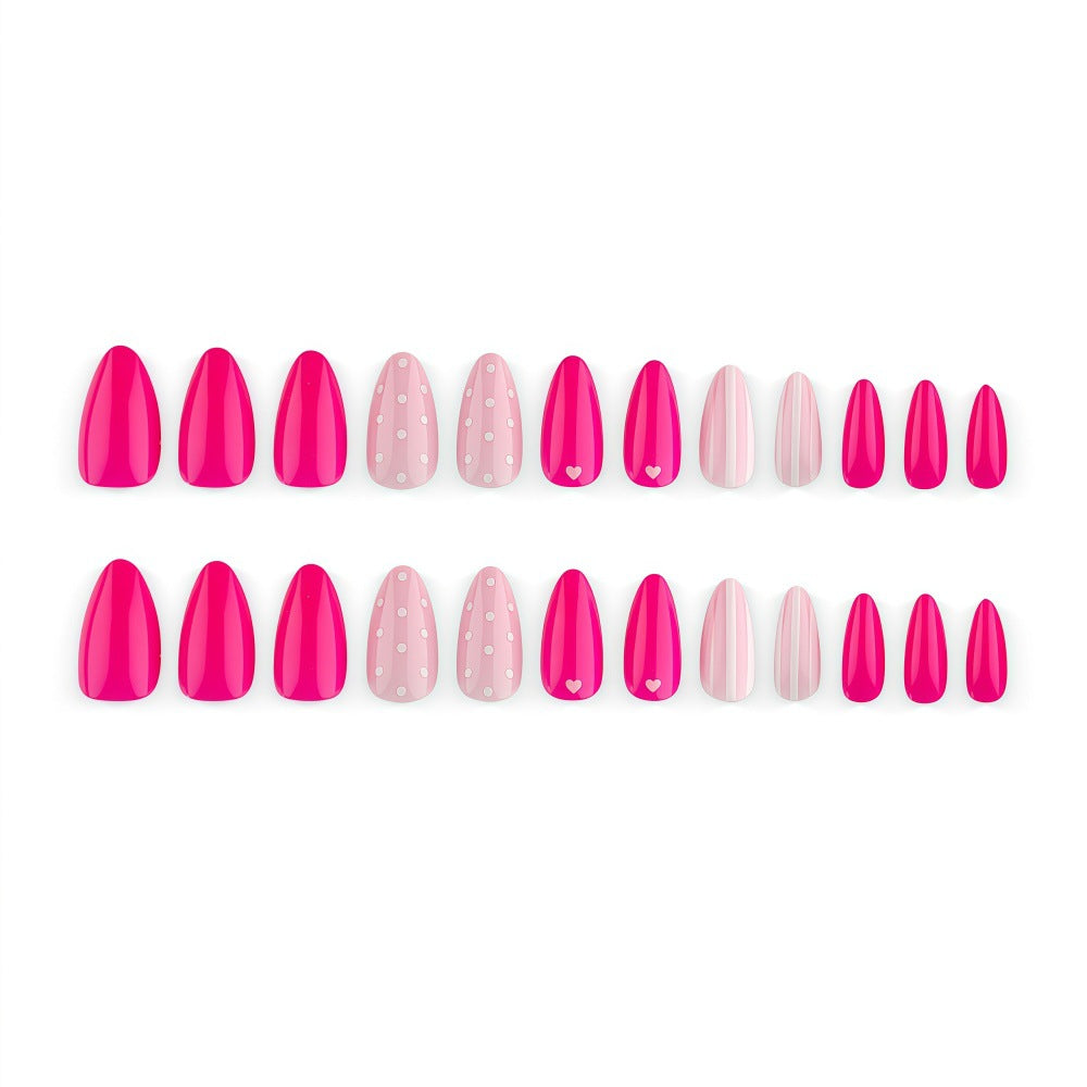 Artificial nails in playful design with hearts and dots Kalsten