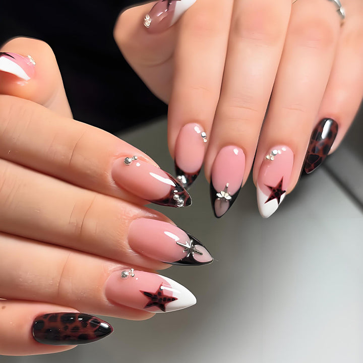 Acrylic nail set with creative star patterns and glitter accents Kalsten