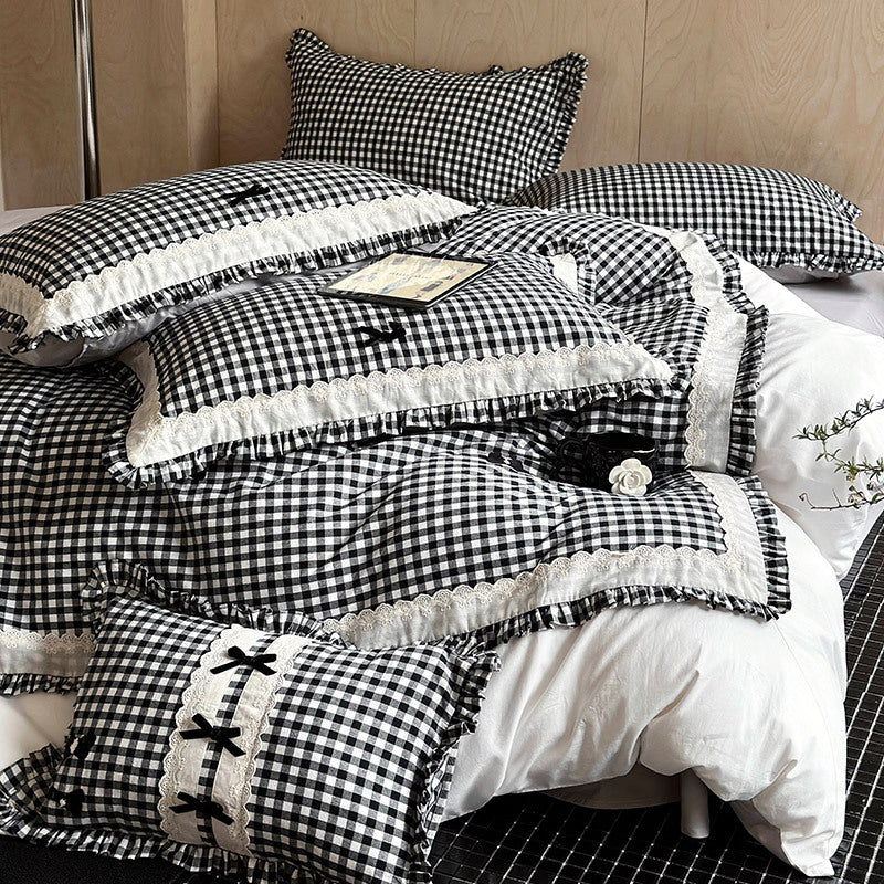 Bedding set in country house style with Vichy check, ruffle and embroidery appliqués