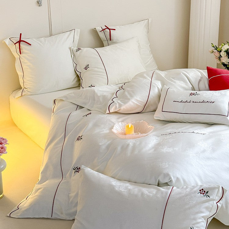 Bedding set with fine embroidery and contrasting piping