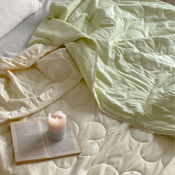 Thin quilted duvet with floral circle quilting and breathable microfiber cover