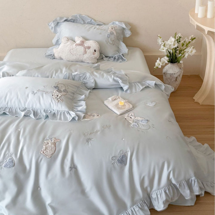 Satin bedding set with ruffles, embroidered bunny appliqués and silky-smooth finish