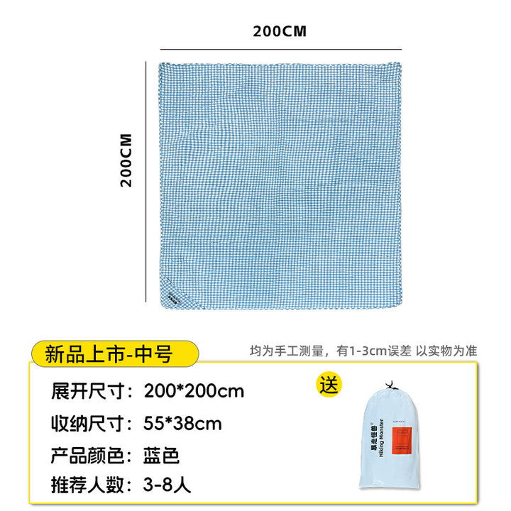 Generous picnic blanket with carry handle and water-repellent underside Kalsten