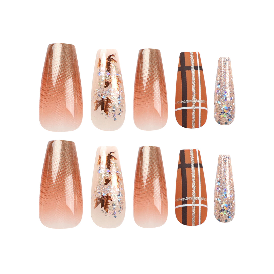 Artful nail extensions with glitter and leaf patterns Kalsten