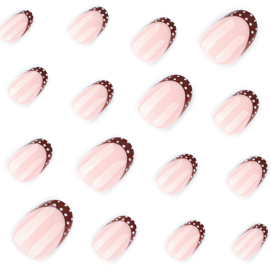 Artful nail design with elegant French tip and accents Kalsten