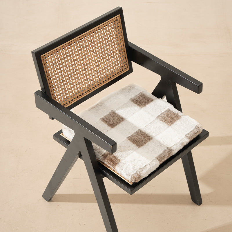 Cozy seat cushion made of faux fur with checked pattern and fastening straps