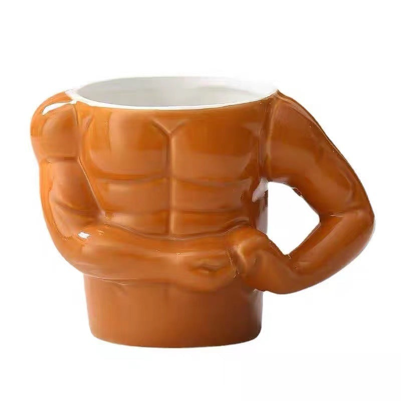 Ceramic mug in torso shape with muscular body and ergonomic handle