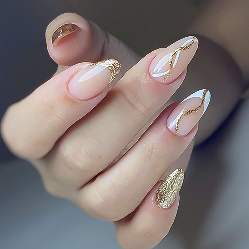 Artful nail art with elegant gold design Kalsten