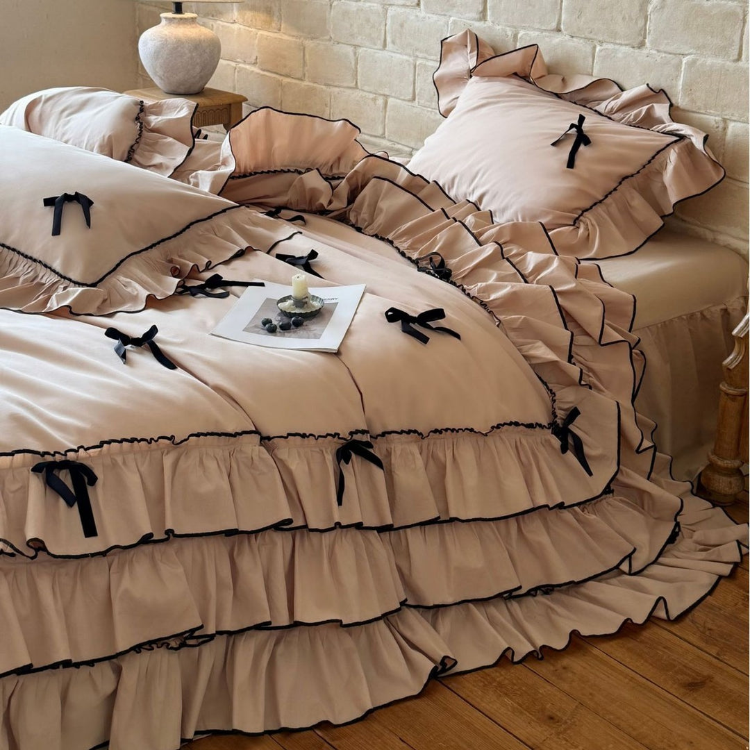 Romantic bedding set with ruffles, frills, and decorative bows