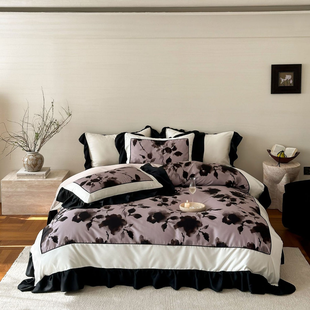 Satin bedding set with watercolored floral print, contrasting piping and flowing ruffles