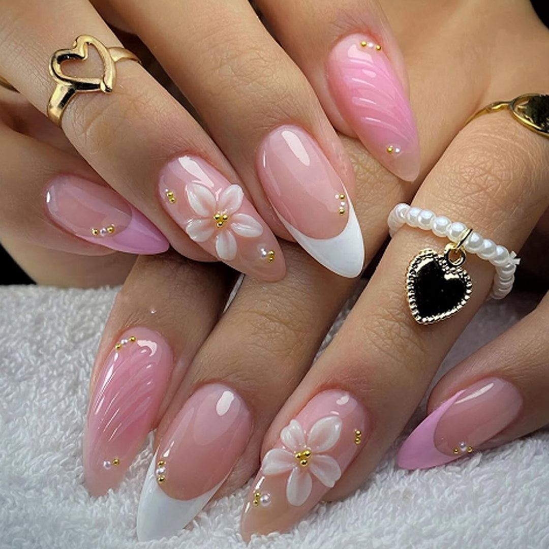 Artificial nail art with floral design and glitter accents Kalsten