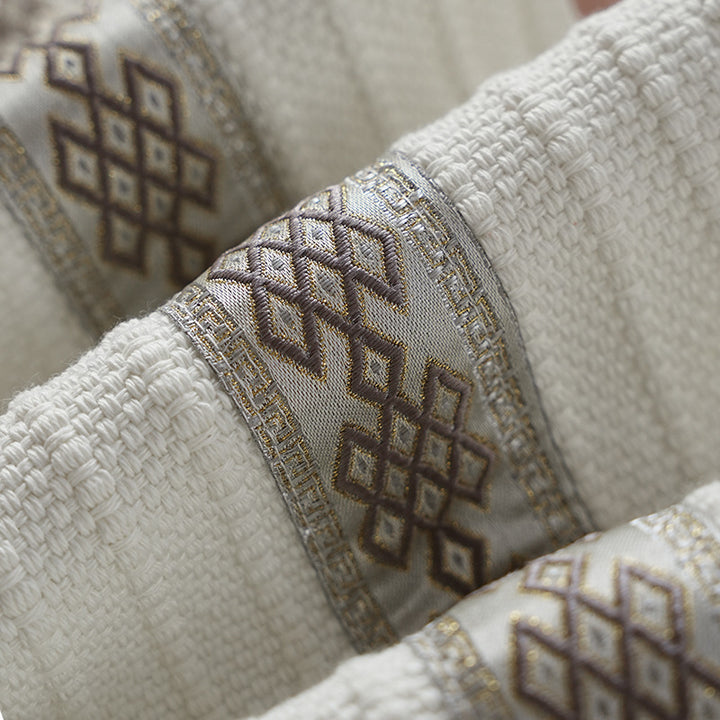 Woven table runner with contrasting center stripe, textured waffle look and decorative fringes