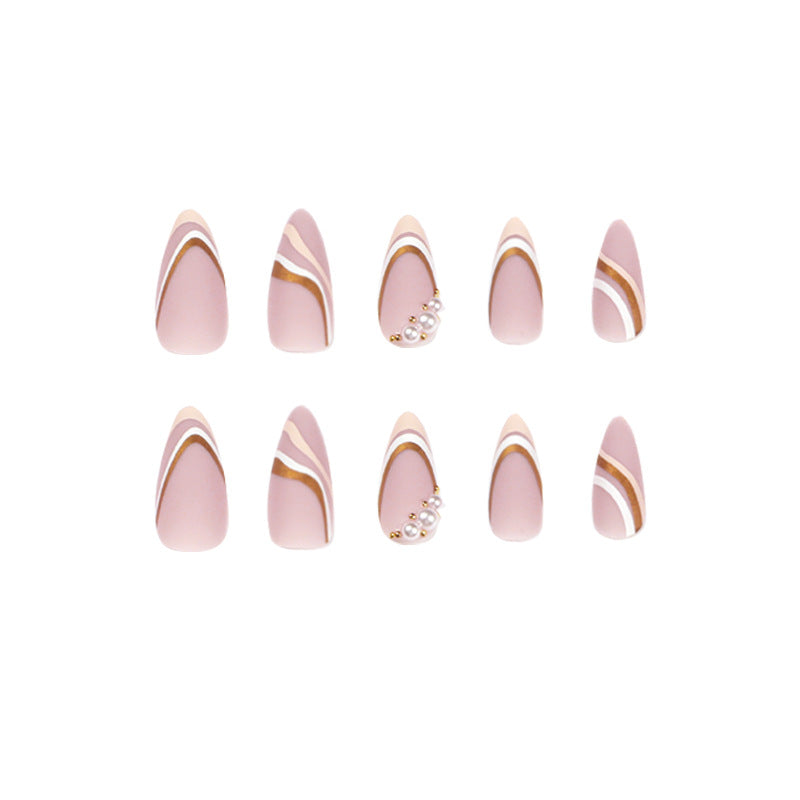 Artful stiletto nails with elegant gold and white accents Kalsten