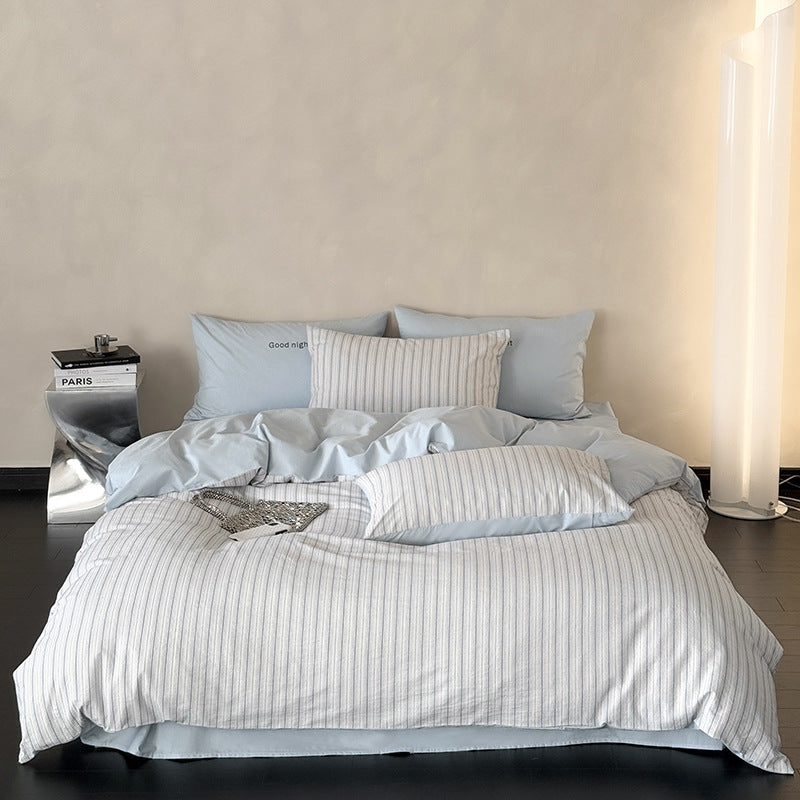 Modern bedding set made of breathable cotton muslin with a fine stripe pattern and reversible function