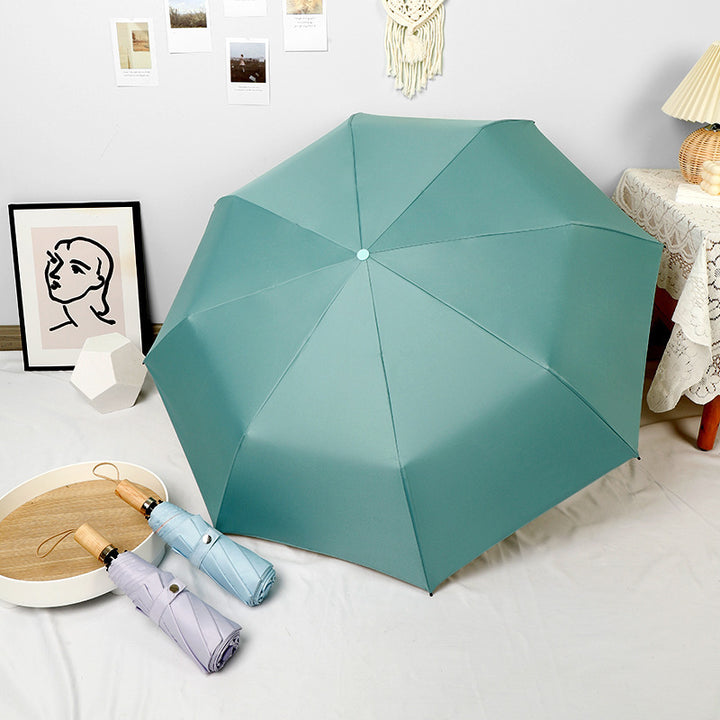 Ladies elegant folding umbrella in portrait format with stylish wooden handle Kalsten