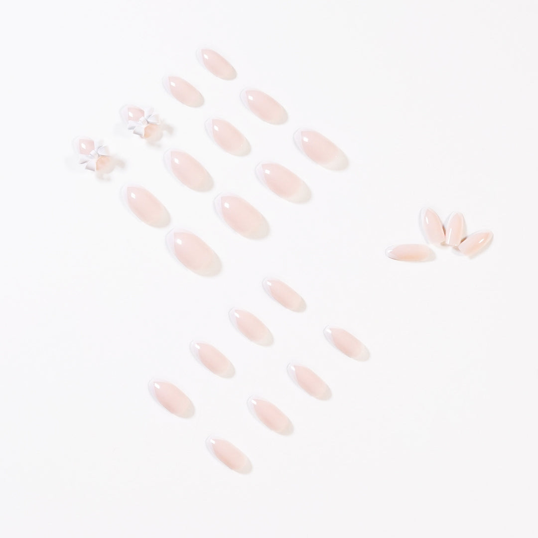 Elegant artificial nails with translucent French tip and decorative floral accents Kalsten
