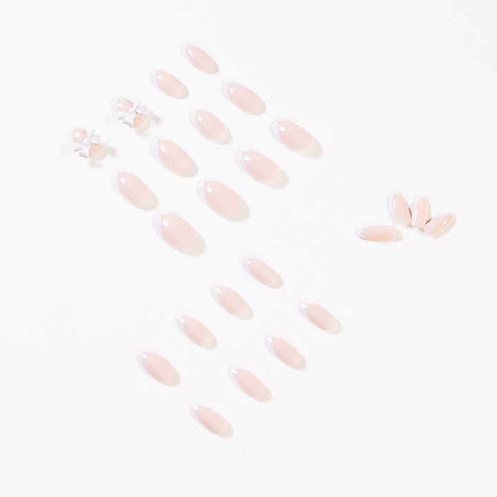 Elegant artificial nails with translucent French tip and decorative floral accents Kalsten