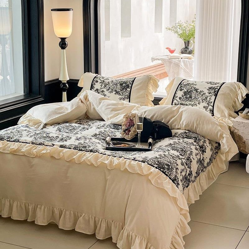 Romantic reversible bedding set made of fine cotton satin with ruffled flounces and toile design