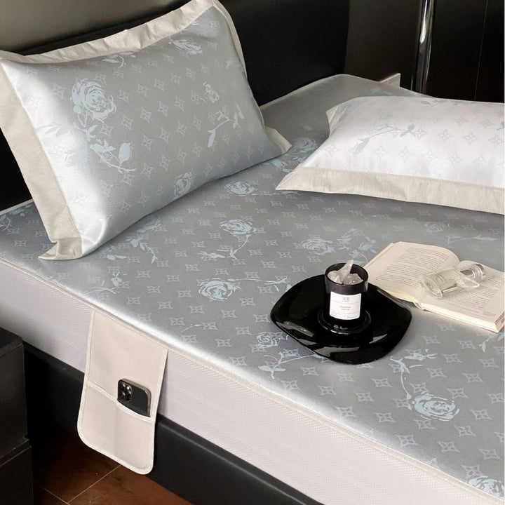 Quilted mattress topper with jacquard pattern and non-slip base