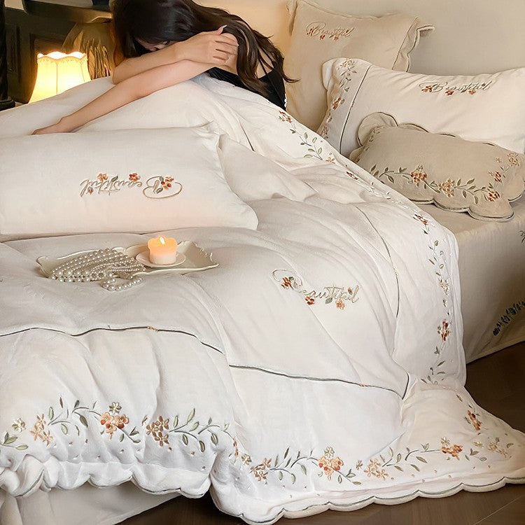 High-quality embroidered bedding set made of cotton percale with ruffled hem and floral relief