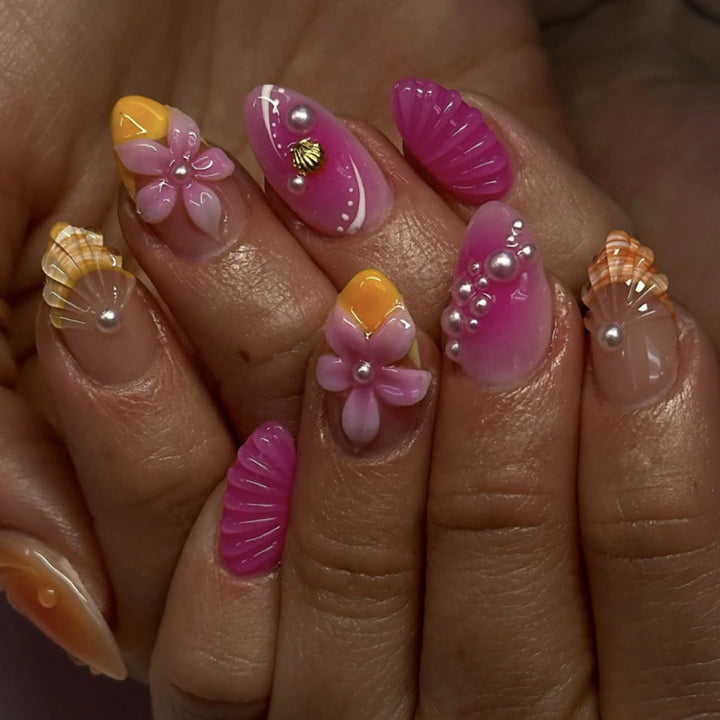 Artful nail extensions with floral and pearl-embellished accents Kalsten
