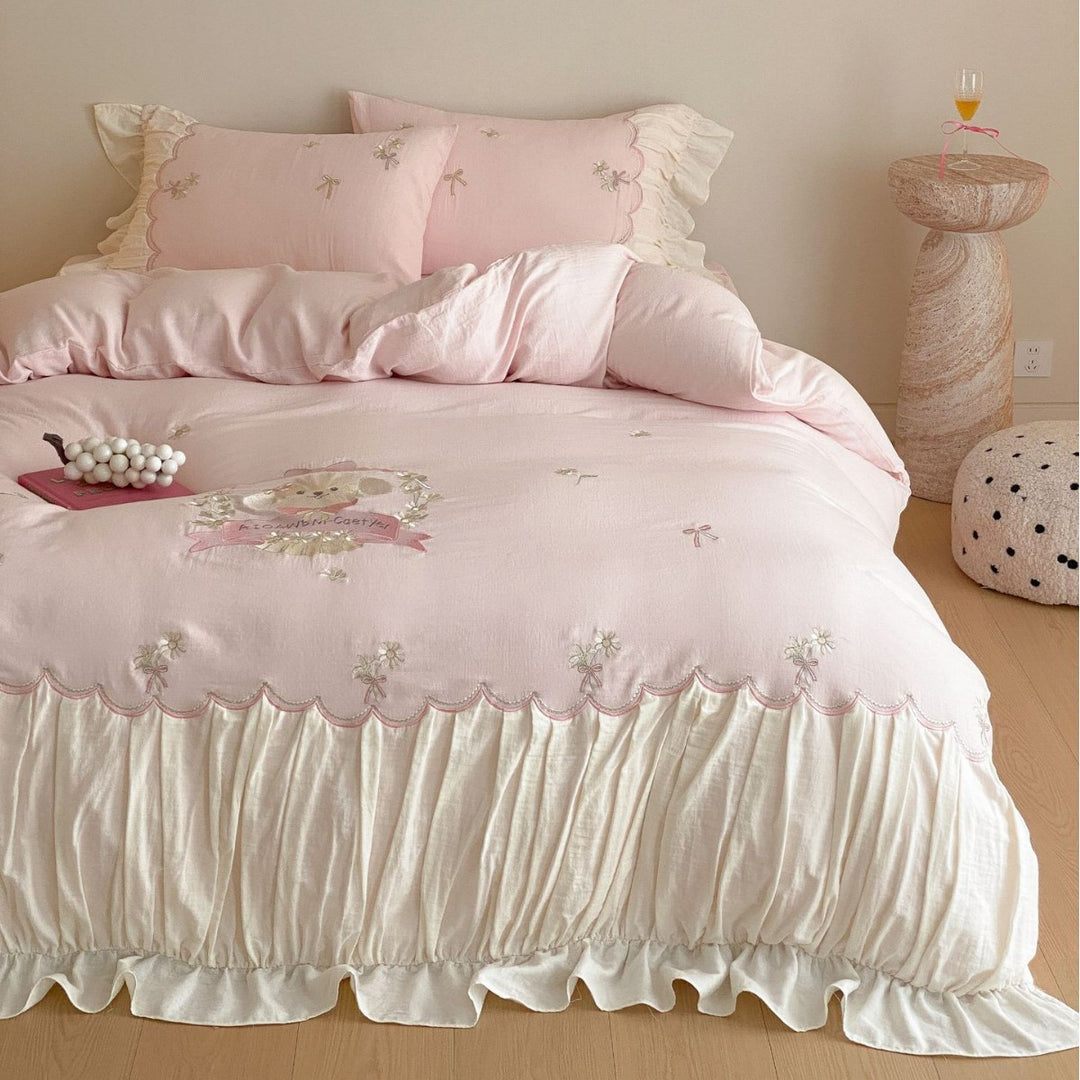 Playful cotton satin bedding set with ruffled bed skirt, floral embroidery, and frill cushion