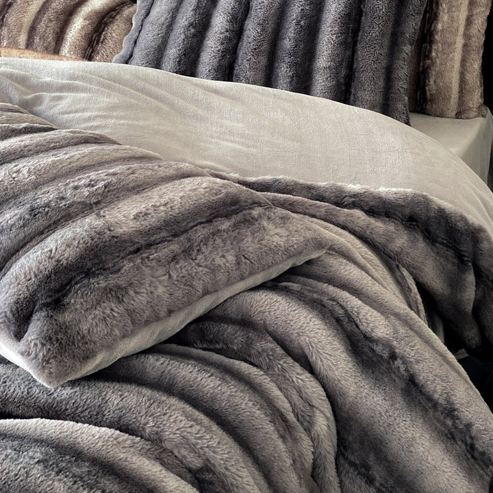 Luxury faux fur throw and cushion set with striped texture