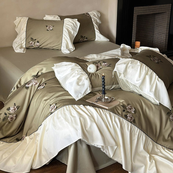 Luxurious satin bedding set with floral embroidery and frills