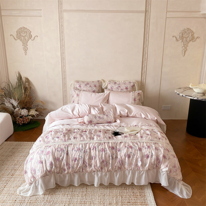 Romantic quilted bedding set with ruffles and floral pattern