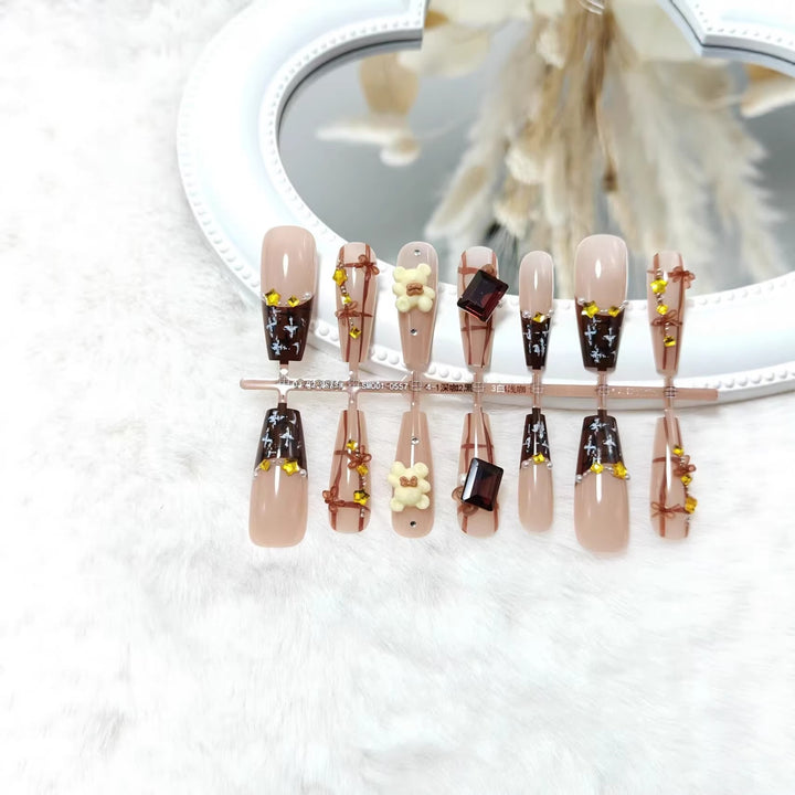 Artificial nails with playful animal designs and glitter effects Kalsten