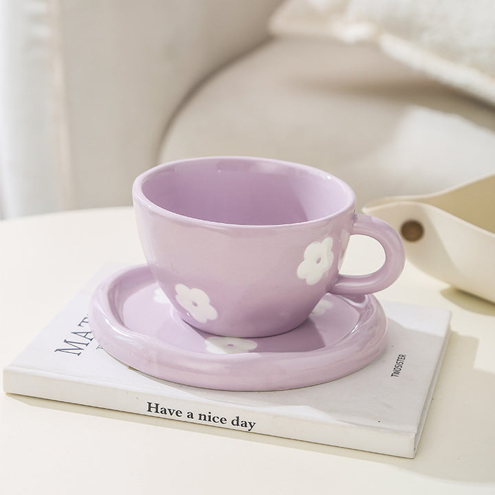 Large ceramic bowl as coffee and tea cup with matching saucer and decorative flower appliqués