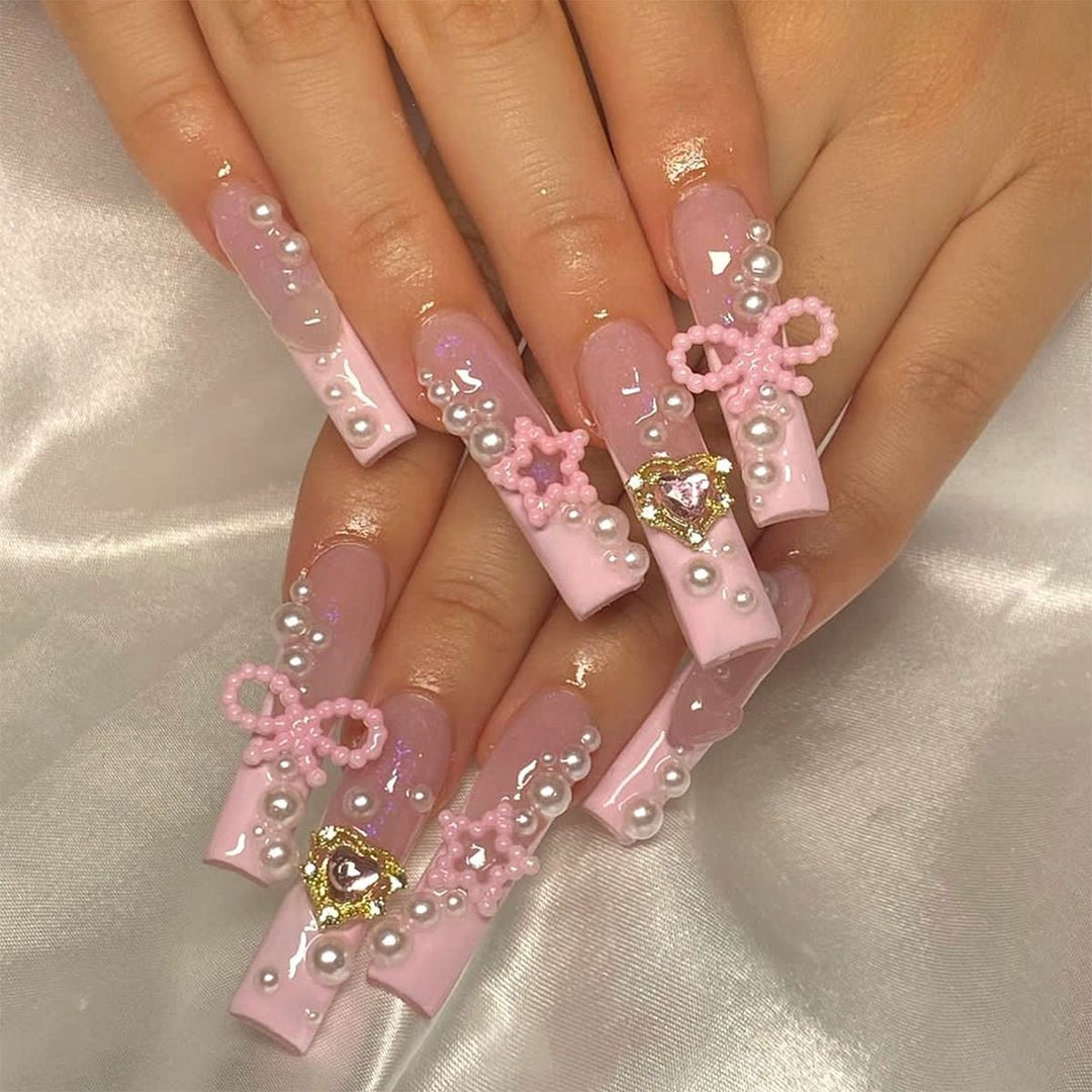 Creative acrylic nail set with delicate pearl and gloss accents Kalsten