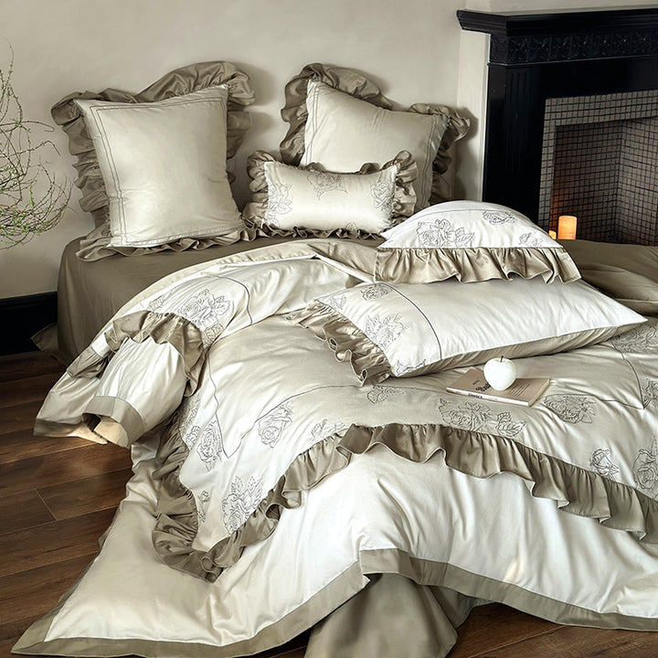 Ruffled bedding set made of cotton satin with rose embroidery and contrast piping